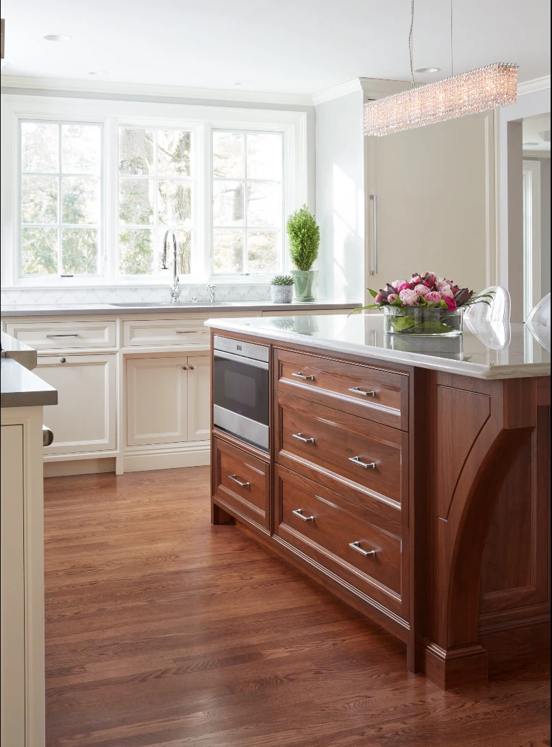 Walnut kitchen island with integrated microwave and tailored drawers